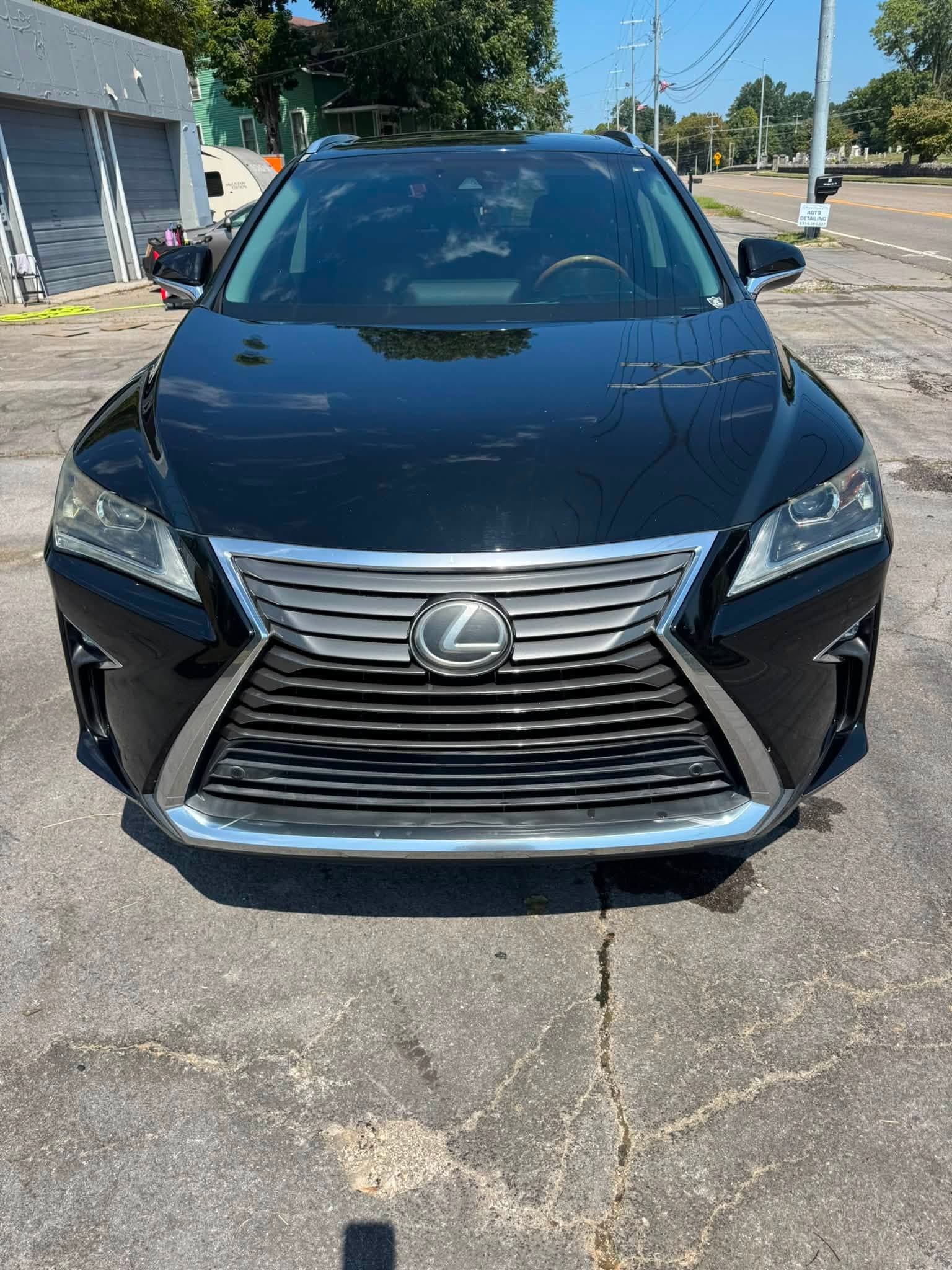 Glossy black Lexus after detailing